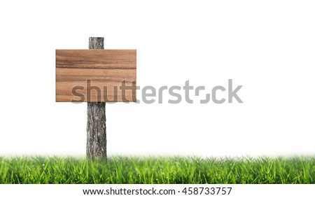 Empty wooden board in green meadow on white background with area for copy space.