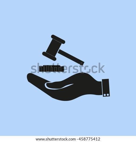 Hand holding judges gavel.