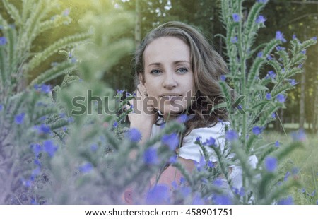 Woman portrait with blue flowers