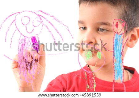 Adorable 6 years old boy painting his family on glass. White background high resolution studio image  focused at his hand, face out of focus.
