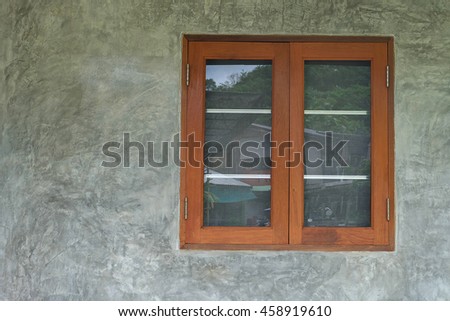 Vintage window on grunge cement wall