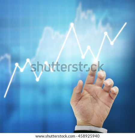 Businessman with financial symbols coming 