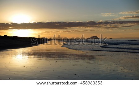     Sunset on the beach, Papamoa, New Zealand                           