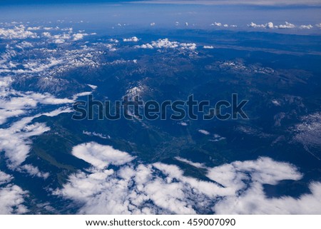 Over clouds plane landscape with beautiful blue sky