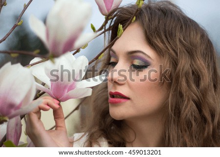 Beautiful spring girl with flowers 