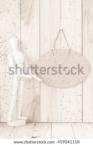 wooden puppets on a wood background, vintage filtered Images