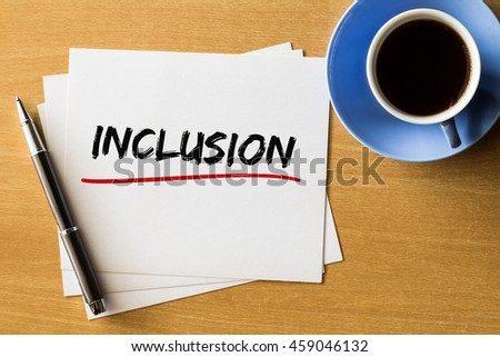 Inclusion - handwriting on papers with cup of coffee and pen, concept