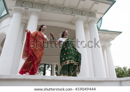 Girl in Indian saree is near palace