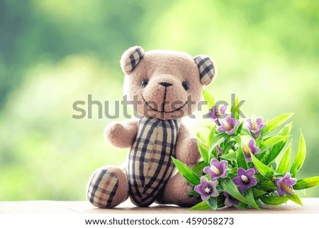 teddy bear and bouquet flowers