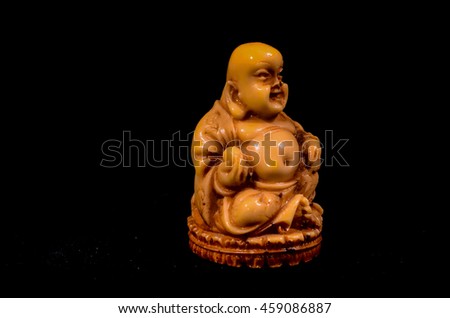 Oriental Buddist Statue Isolated on a Black Background