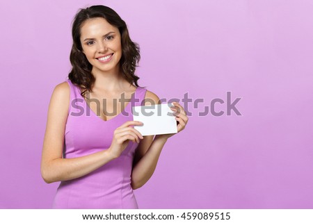 Woman holding blank card.