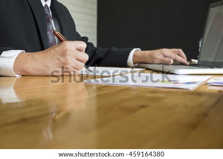 A businessman sign or discussing document or graph.Close up shot.