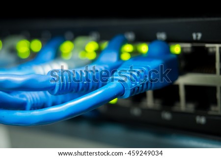 ethernet cables connected with internet switch at data center, information technology Computer network Royalty-Free Stock Photo #459249034