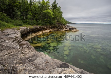 Cove On The Coast Of Lake Superior  In Michigan. Cliff on the shores of Lake Superior in Michigan's Upper Peninsula. Royalty-Free Stock Photo #459441403