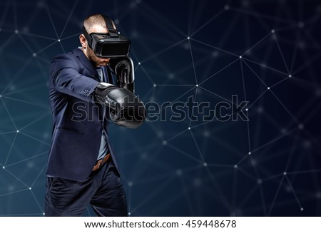 Fighter in a suit with virtual reality glasses device on his head over futuristic background.