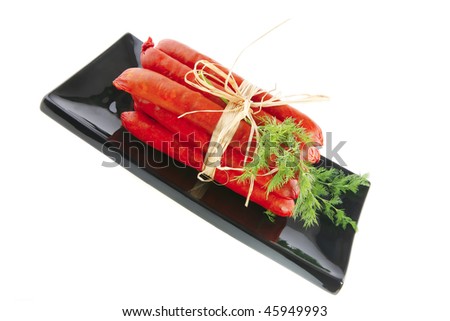 smoked beef sausages served on a black plate