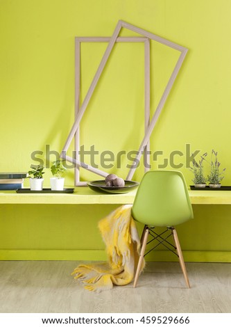 modern green wall interior work desk and green chair with yellow warp