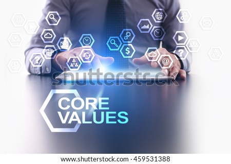 Businessman is using tablet pc and selecting Core values icon.
