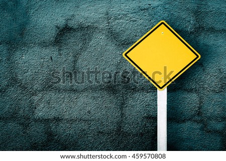 traffic sign post with dark crack wall background