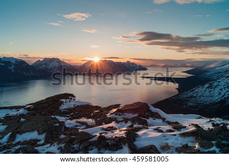 Midnight sun over Lyngen and Kafjord. 
North / Arctic Norway Royalty-Free Stock Photo #459581005