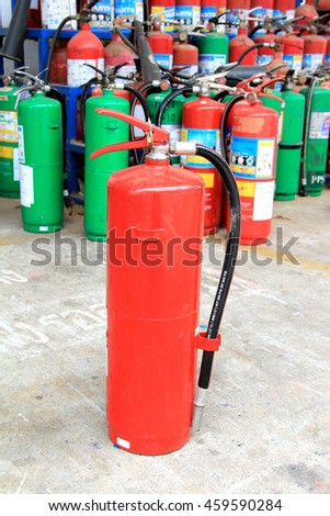 Fire extinguishers of Dry chemical type or red tank.