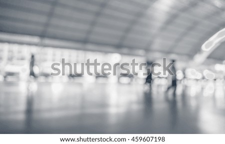 blur image of people in the lobby of a modern business center with a blurred background.