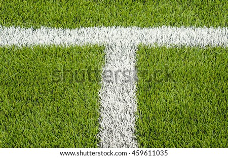 The white Line marking on the artificial green grass soccer field 
