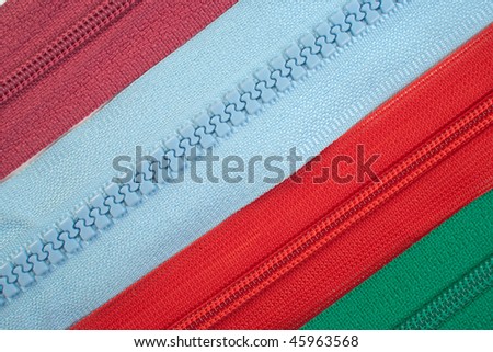 Four colorful zippers