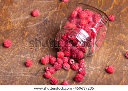 Lots of fresh bright red raspberries. Selective focus. Shallow depth of field.