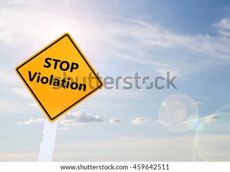 Text for STOP Violation on yellow road sign with blur blue sky background