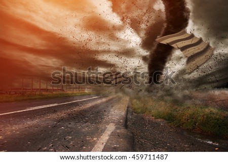 Picture of a large tornado destroying the landscape