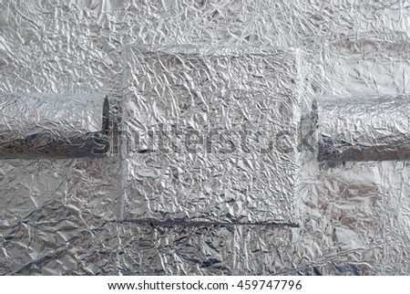 Foil figures with shiny crumpled surface. Contemporary art