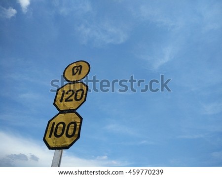 Signs indicating traffic speed Background sky