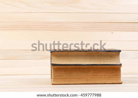 Books on wooden table. Back to school. Copy space.