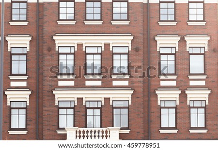 Town house in a flat style with square windows.