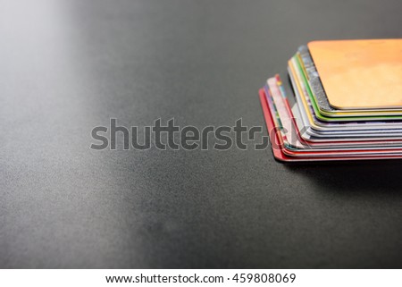 Credit discount card for shopping Stack of business visit money bank card, gift, ticket, pass, present close up on blackboard table background Copy space Blank corporate identity package business card