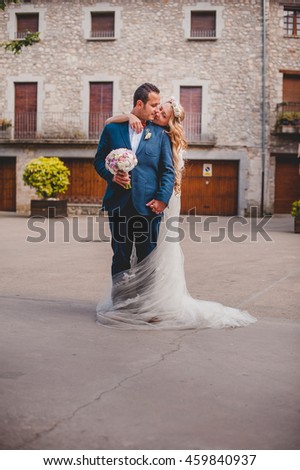 Lovely young woman  standing behind groom