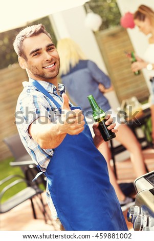 Picture presenting group of friends having barbecue party
