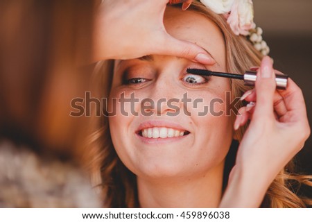 makeup artist doing makeup for a amazing  girl