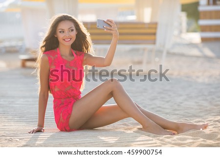 Beautiful girls selfie self photo on beach vacation during summer travel holidays.