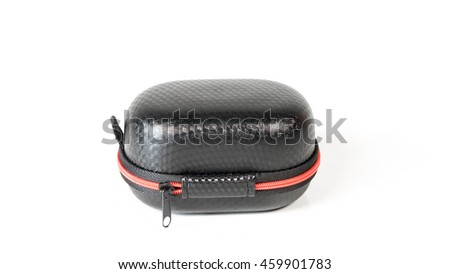 Small zipped case box for small microphone lapel or lavalier. Isolated on white background. Slightly de-focused and close-up shot. Copy space.