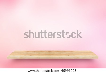 Wooden shelves display for present product with Pink Gradient blurred abstract background.