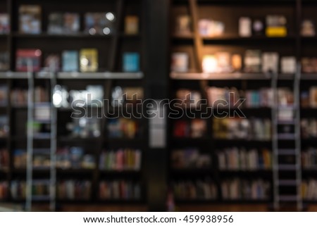 blurred background of bookshelf with ladder in a library