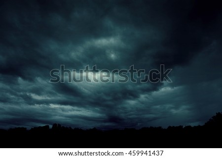 Background of dark sky before a thunder-storm  Royalty-Free Stock Photo #459941437
