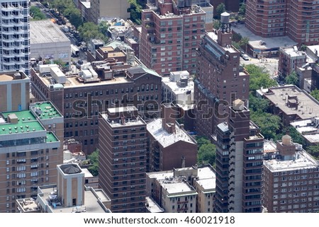 Aerial establishing photo of New York City buildings in the Manhattan skyline. Looking down on rooftops from high above.