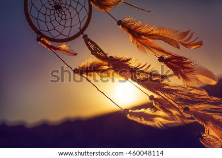 Dreamcatcher sunset , the mountains, boho chic, ethnic amulet,symbol Royalty-Free Stock Photo #460048114