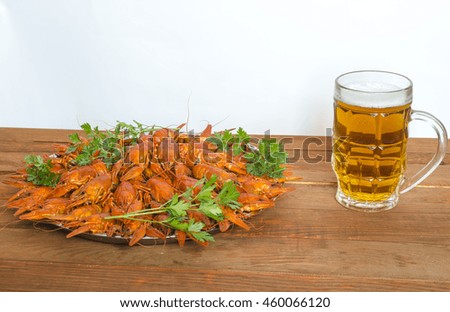 boiled crayfish with parsley on a wooden table