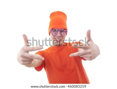 Party maker. young party-goer in orange dress makes signs with his hands - peace brother - show must go on. focus on fingers 