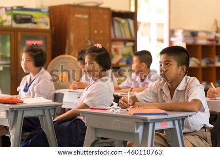 Education, Student, People concept - Group of Asian students in uniform studying together at classroom. Asian students looking happy to study.
 Royalty-Free Stock Photo #460110763