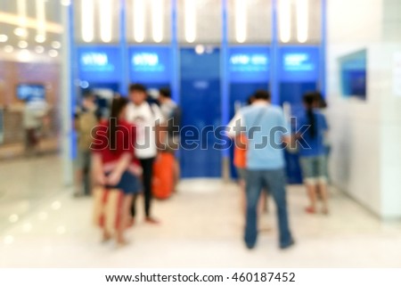 Blur image of people at automatic teller machine (ATM) for background uses